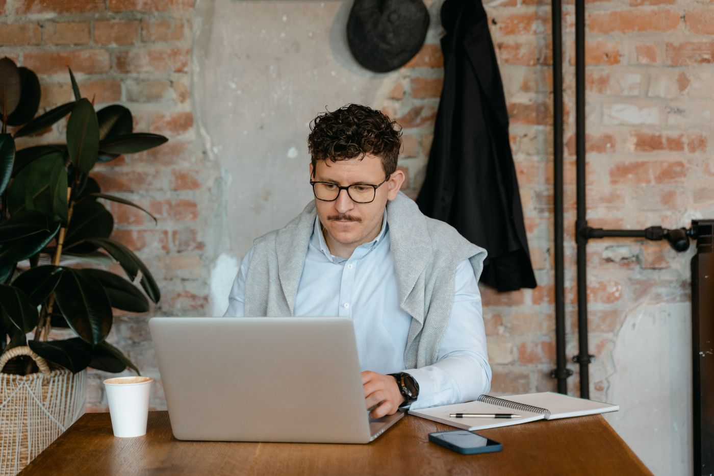 A finance officer reviewing figures at a laptop
