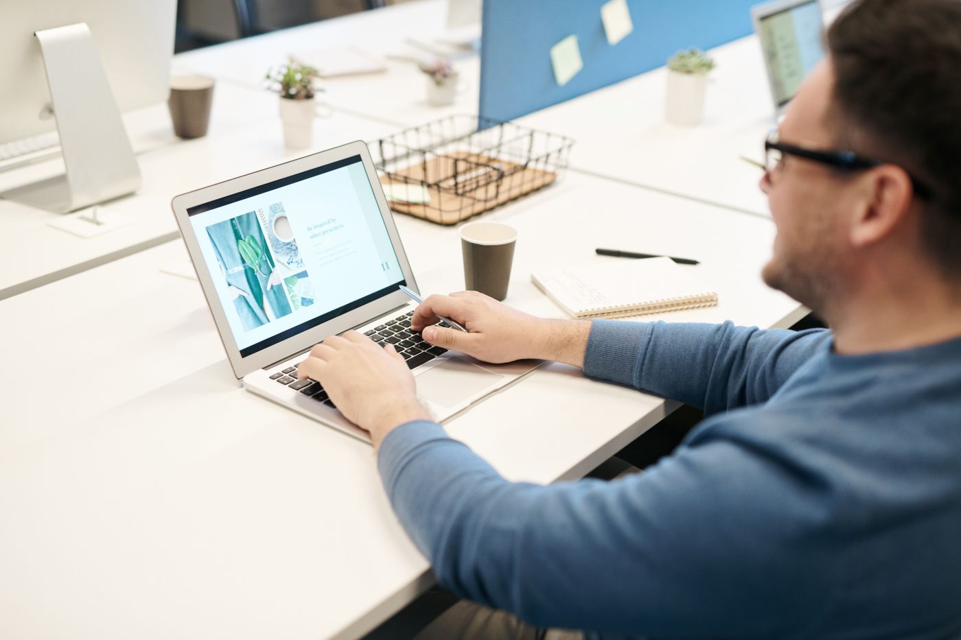 An e-commerce executive managing listings at a laptop