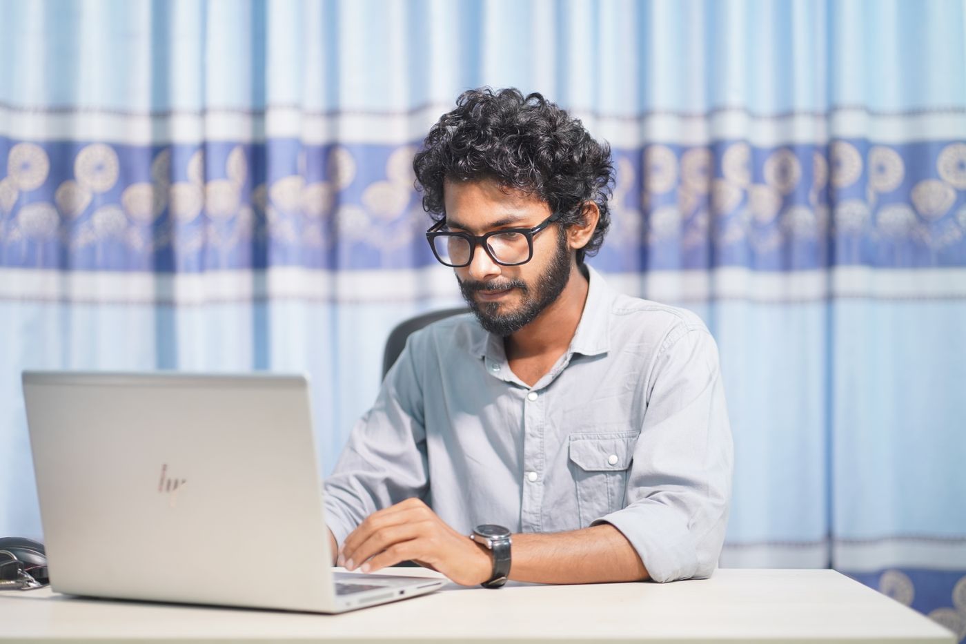 An engineer checking integrations at a laptop